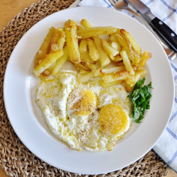 Spanish Eggs With Fried Potatoes In Extra Virgin Olive Oil