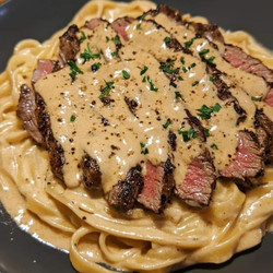 Spicy Cajun Steak with Creamy Alfredo Pasta