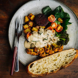 Oven vegetables with spinach salad and soy yoghurt sauce