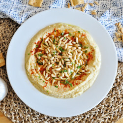 How To Make The Creamiest Garlic Hummus With Pine Nuts &amp; Paprika