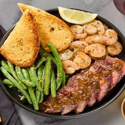 Steak Au Poivre &amp; Garlic Herb Shrimp With Garlic Bread &amp; Lemony Green Beans