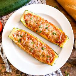 Stuffed Zucchini With A Rich Tomato Sauce