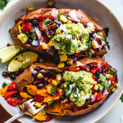 Vegan Black Bean-stuffed Sweet Potatoes With Coconut Sour Cream And Guacamole