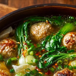 Ginger Chicken Meatball Soup With Baby Bok Choy And Wonton Strips