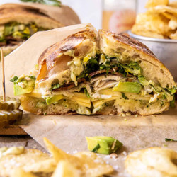 Picnic Style Pesto Turkey And Avocado Bacon Sandwich