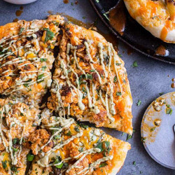 Buffalo Roasted Cauliflower Skillet Pizza With Chipotle Blue Cheese Avocado Drizzle.