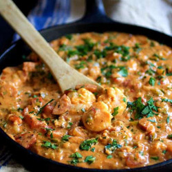 Smothered Shrimp With Andouille Sausage And Creamy Parmesan Peppercorn Grits