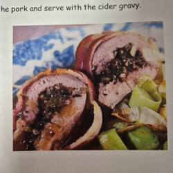 Roast loin of pork with black pudding stuffing and cider gravy