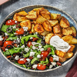 Patatas Bravas! Spanish baked potatoes with olives, rocket, dried tomatoes and aioli