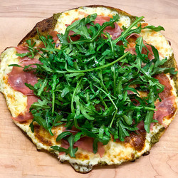 Cauliflower Crust Pizza With Pesto, rocket + Prosciutto