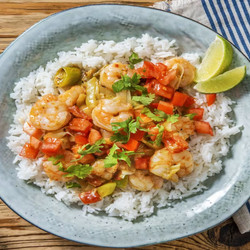 Garnalen In Vadouvan-curry Met Rijst, Limoen En Verse Koriander