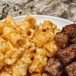 Cajun Steak Tips In Cheesy Rigatoni Parmesan Sauce