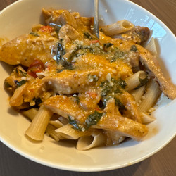Baked Boneless Chicken Thighs in Alfredo with tomatoes and spinach