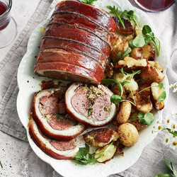 Herby Stuffed Saddle Of Lamb With Crushed Roasties