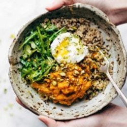 Healing Bowls With Turmeric Sweet Potatoes, Poached Eggs, And Lemon Dressing