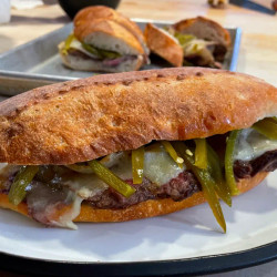 Steak Torta With Charred Onions, Melted Cheese And Pickled Jalapeños