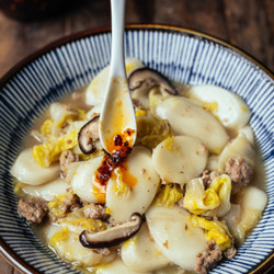 Braised Rice Cakes With Napa Cabbage, Shiitake And Pork