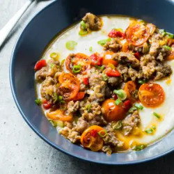 Spicy Italian Sausage With Cheddar Grits And Cherry Tomatoes