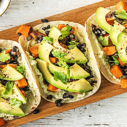 Sweet Potato And Black Bean Tacos With Avocado Crema And Cilantro