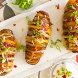 Swedish Hasselback Pit Roasted Cheesy Bacon Potatoes