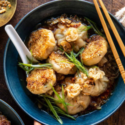 Sesame Chicken Dumplings In Spicy Broth With Garlic Crisps