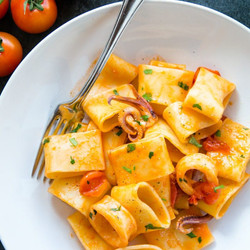 Classic Italian Calamarata - Pasta With Calamari &amp; Tomato Sauce