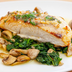 Nile Perch Medallions On A Bed Of Mushrooms And Spinach