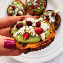 Sweet Potato Bites With Avocado Mash, Feta + Pomegranate Seeds