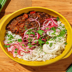 Comforting Chorizo And Black Bean Frejolada With Pickled Red Onion, Soured Cream And Coriander