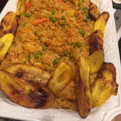 Nigerian Jollof Rice With Chicken And Fried Plantains