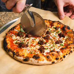 Lahmacun with Spiced Lamb Sausage, Armenian String Cheese, and Sumac