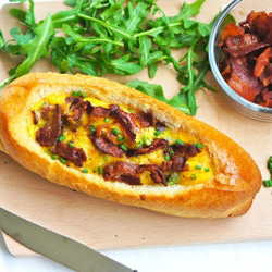 Baguette Filled With Prosciutto, Scrambled Eggs, And Bacon
