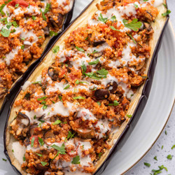 Quinoa Stuffed Eggplant With Tahini Sauce