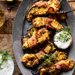 Bacon Wrapped Cheddar Corn Jalapeño Poppers With Cilantro Lime Ranch.