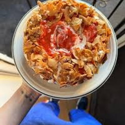 Corn cake with guava-strawberry jam, cinnamon cream and caramelised coconut