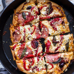 Sun-dried Tomato And Olive Pesto Pizza With Salami + Roasted Red Peppers.
